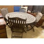 An Alexander Rose circular weathered teak garden table, diameter 144cm, height 71cm (no bolts) and