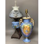A French porcelain blue ground vase (converted to electricity) and a glass oil lamp,with cast metal
