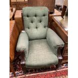 A Victorian mahogany framed armchair, in pale blue upholstery