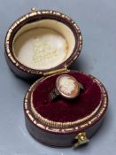 A yellow metal and oval cameo shell set child's ring,size D, gross 1.4 grams.