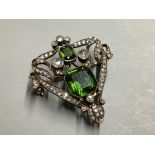 A Victorian gold and silver openwork pendant-cum-brooch set with rose-cut diamonds and emerald cut