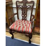 A pair of George III style Irish design mahogany elbow chairs