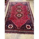 A Caucasian design red ground carpet, 336 x 220cm