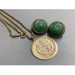 A Chinese 14K gold circular pendant, on gilt metal chain and a pair of carved green jade cabochon