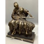 A 20th century cold cast bronze resin figure group of a mother and daughter playing an instrument,