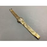 A vintage ladies' Omega 18ct gold ladys' wristwatch on integral mesh bracelet,having circular