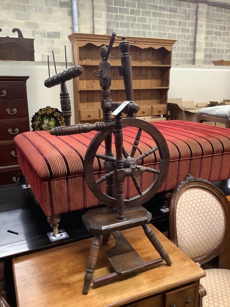 A provincial turned beech spinning wheel, height 100cm