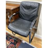 A pair of Knoll International Mies Van De Roue chrome and black leather cantilever elbow chairs,