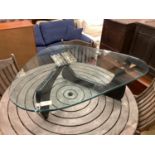 A Isamu Noguchi style coffee table,the triangular heavy glass top (approximately 2cm thick) on