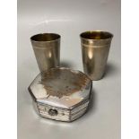 A silver plated puzzle box, 1754, and two boxed Russian beakers, 7.5cm