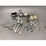 A three-piece silver condiment of oval half-reeded form, two silver sifter spoons, a pair of silver