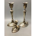 A pair of Mappin & Webb George III style silver candlesticks and a similar dwarf candlestick,all of