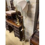 An adjustable gilt standard lamp and a pair of corinthian column lamps