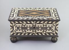 An early 18th century Dutch Colonial casket,inlaid with bone and ebony, the hinged cover revealing