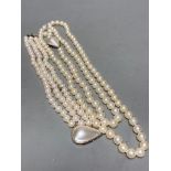 A single strand cultured pearl necklace, with a mother of pearl set 14k white metal clasp, 90cm,