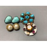 A circular silver gilt and seven-stone turquoise brooch, a pair of silver-mounted clip earrings and