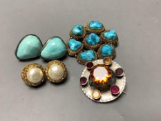 A circular silver gilt and seven-stone turquoise brooch, a pair of silver-mounted clip earrings and