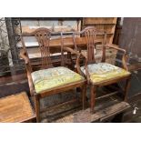 A pair of George III mahogany open elbow chairs