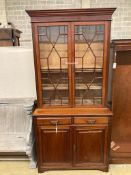 A Victorian mahogany bookcase cupboard, length 106cm, depth 47cm, height 222cm