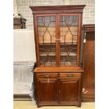 A Victorian mahogany bookcase cupboard, length 106cm, depth 47cm, height 222cm