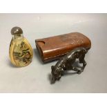 A bronze dog, a Chinese snuff bottle and a stamped leather cigar case