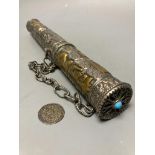 A Tibetan metal incense holder, length 33.5cm, and a Tibetan coin