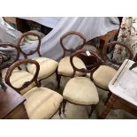 A set of six Victorian carved walnut balloon back dining chairs