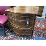 A George III design mahogany serpentine chest, fitted brushing slide and three drawers, width 77cm