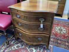 A George III design mahogany serpentine chest, fitted brushing slide and three drawers, width 77cm
