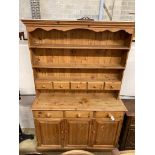 A Victorian style pine dresser, length 140cm, depth 44cm, height 208cm