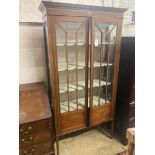 An Edwardian inlaid mahogany display cabinet, width 100cm, depth 33cm, height 194cm