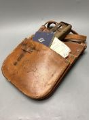A 1950's London Transport bus conductor's satchel, ticket holder and rule book