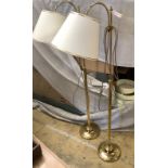 A pair of gold-coloured metal adjustable floor lampswith shades