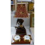 A Wempe wall-mounted ship's style clock/barometer and an 'elephant on books' table lamp