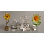 A Swarovski 'Sunflower', with topaz centre and yellow petals in clear glass pot (boxed), a smaller