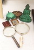 A French Art Deco green glass ashtray, a similar green glass Buddha, two magnifying glasses and a