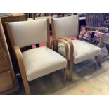 A pair of mid century elbow chairs