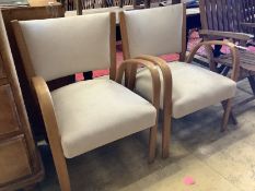 A pair of mid century elbow chairs