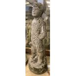 A reconstituted stone garden ornament of a boy with dog, height 69cm