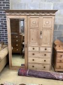 An Edwardian pine compactum wardrobe retailed by Maple & Co., length 113cm, depth 60cm, height