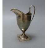 A George III silver helmet shaped cream jug, I.B, London, 1800, 14.9cm,114 grams.