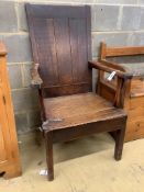 An early 18th century oak elbow chair, width 68cm, depth 63cm, height 112cm