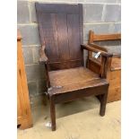 An early 18th century oak elbow chair, width 68cm, depth 63cm, height 112cm