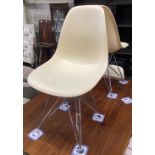 A set of four Eames fibre glass Eifel base chairs