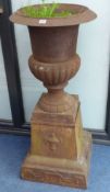 A pair of cast iron campana garden urns, height 112cm