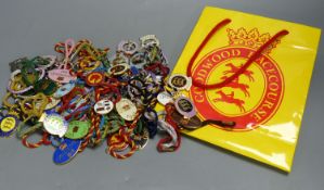 A collection of 60 Goodwood Racecourse Members enamelled badges, 1980's-2000's,on twisted coloured