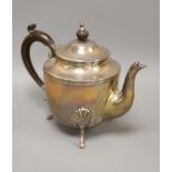 A circular silver teapot on three feet, Sheffield 1900,gross 16.5oz