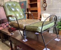 A 19th century wrought iron campaign chair with buttoned green leather seat and back