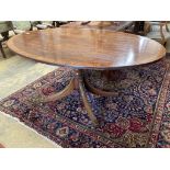 A Regency style oval banded mahogany dining table, length 150cm, depth 103cm, height 76cm