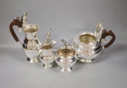 A four-piece silver 'Regent' tea service,of circular bulbous form, comprising teapot, hot water